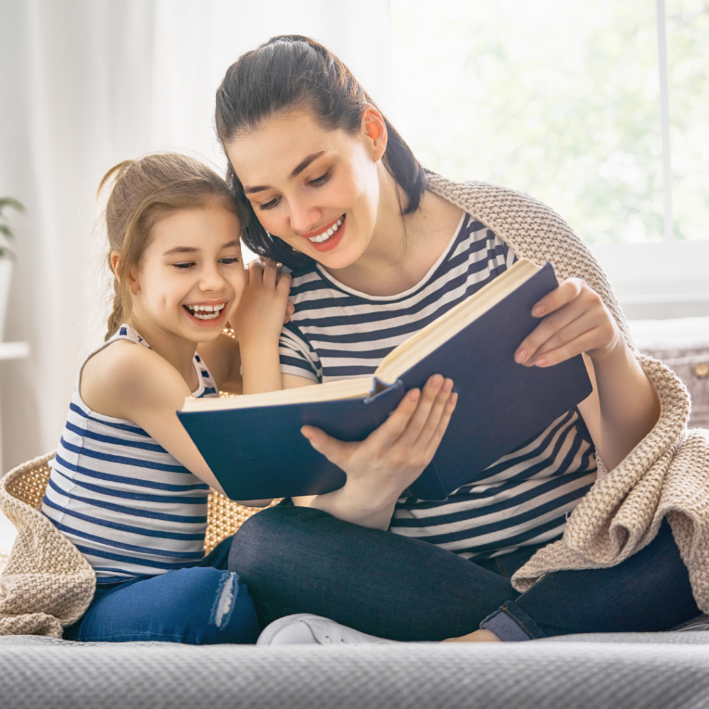 Mother and daughter reading a book together