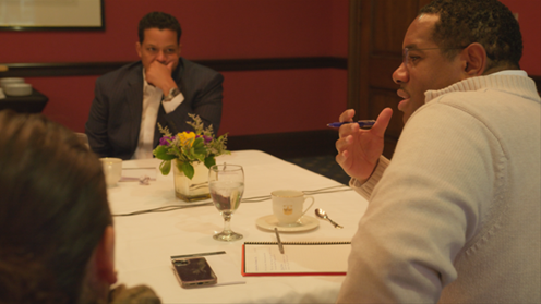 Devin Cotten listening to participants at community working session