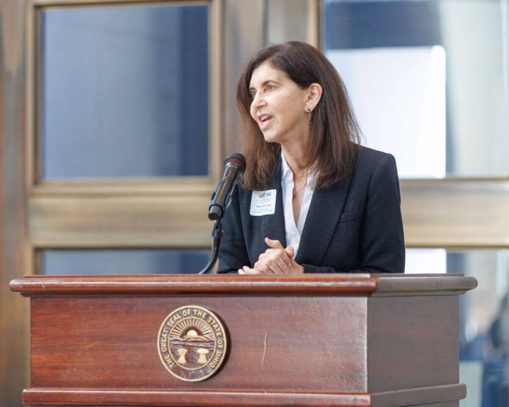 Sharon Sobol Jordan speaking at Statehouse podium