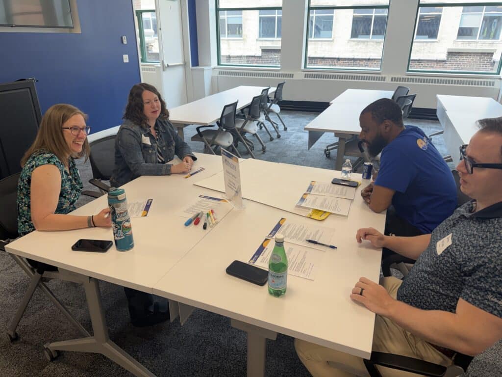 lead united members having a discussion at a table
