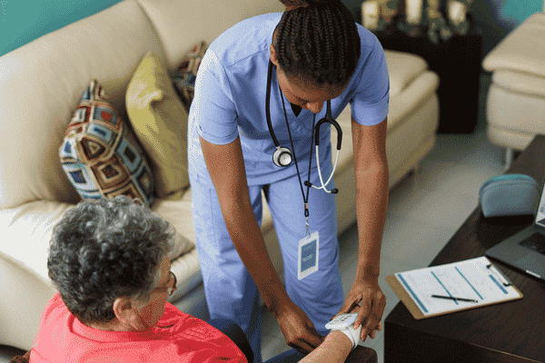 home health aide helping client